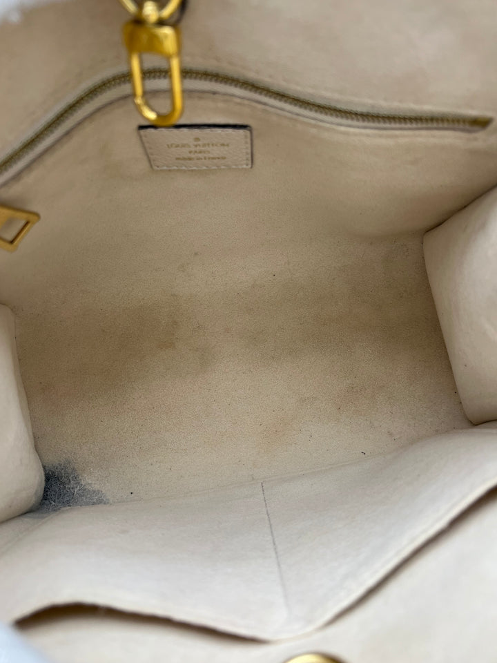 LOUIS VUITTON ON THE GO PM EMPREINTE