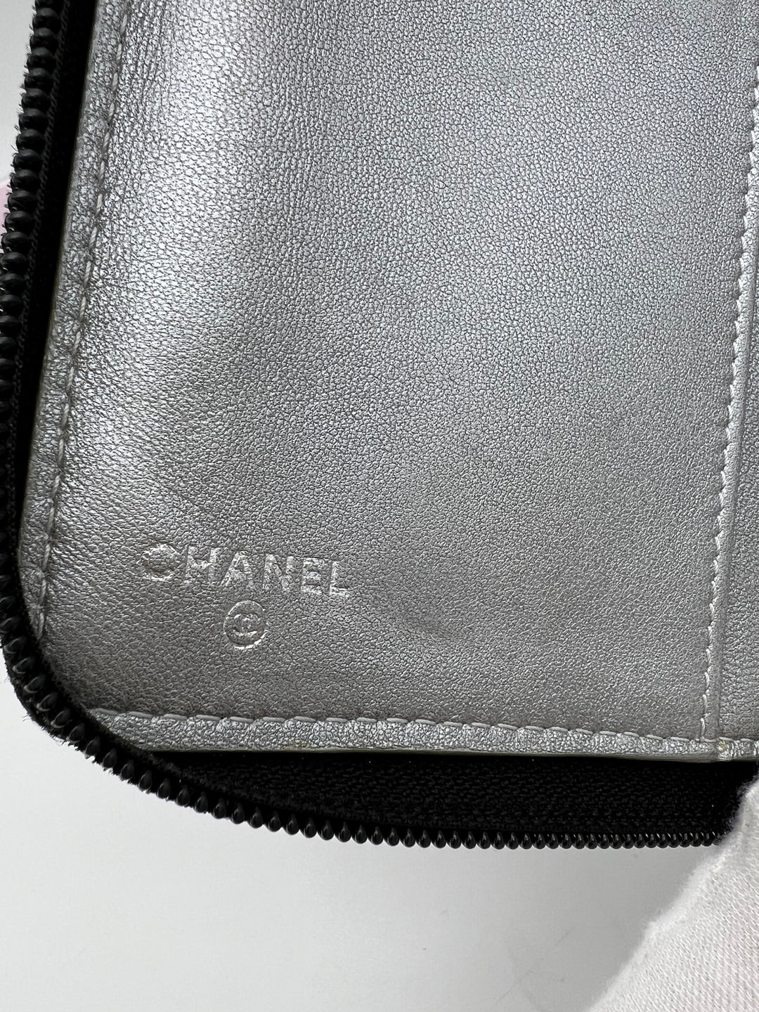 CHANEL LAMBSKIN CAMELLIA EMBOSSED ZIP AROUND ORGANISER WALLET