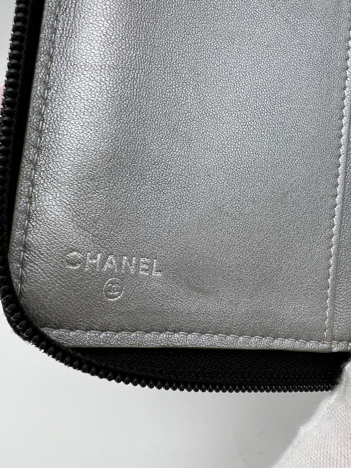 CHANEL LAMBSKIN CAMELLIA EMBOSSED ZIP AROUND ORGANISER WALLET