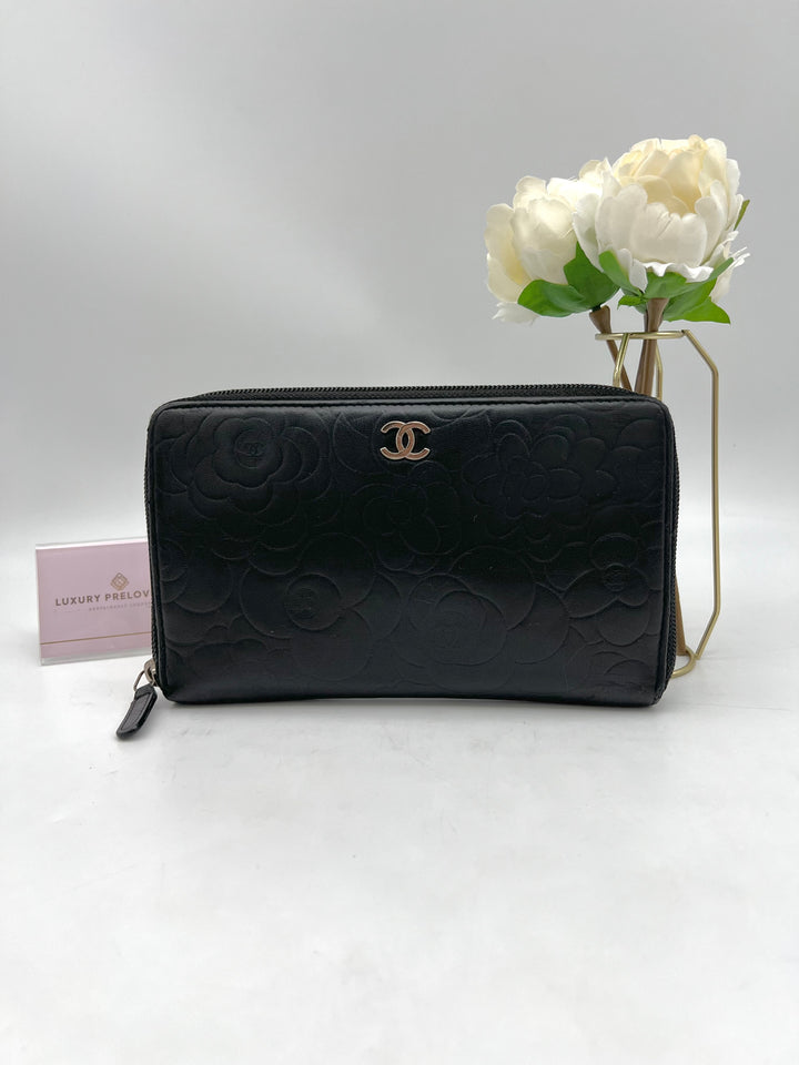 CHANEL LAMBSKIN CAMELLIA EMBOSSED ZIP AROUND ORGANISER WALLET