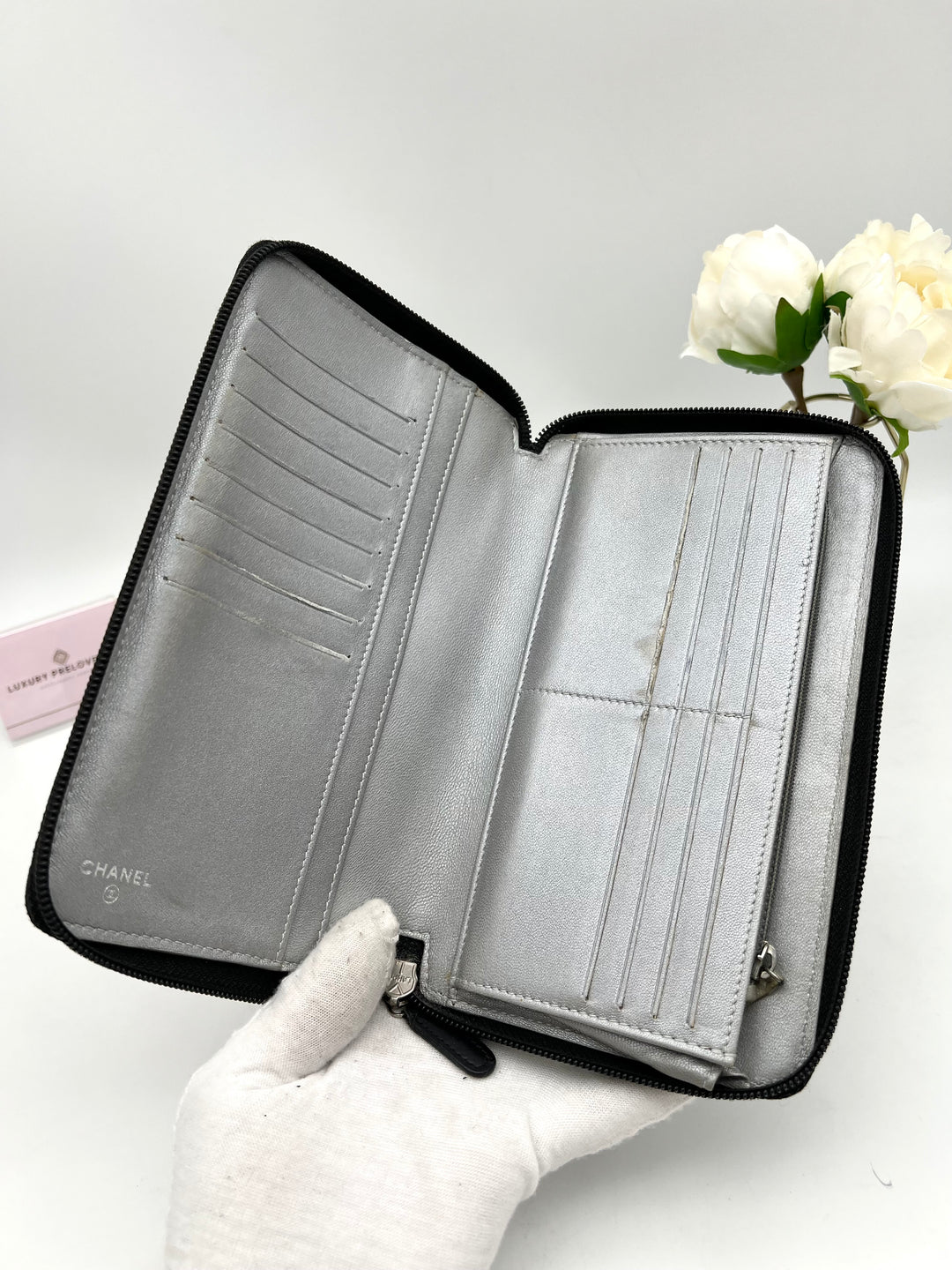 CHANEL LAMBSKIN CAMELLIA EMBOSSED ZIP AROUND ORGANISER WALLET