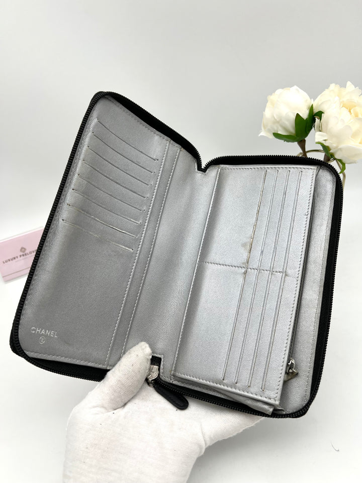 CHANEL LAMBSKIN CAMELLIA EMBOSSED ZIP AROUND ORGANISER WALLET