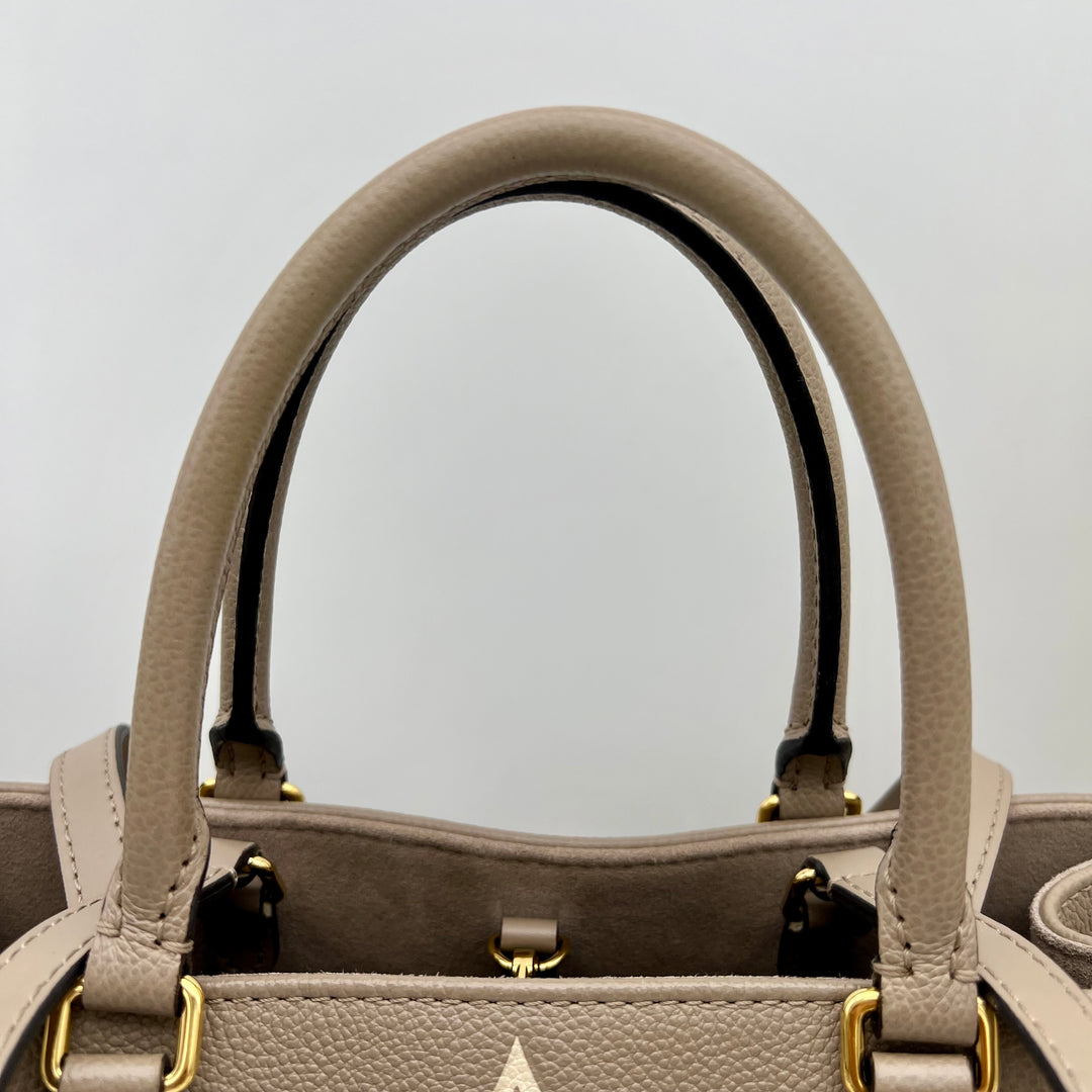 LOUIS VUITTON ON THE GO MM EMPREINTE