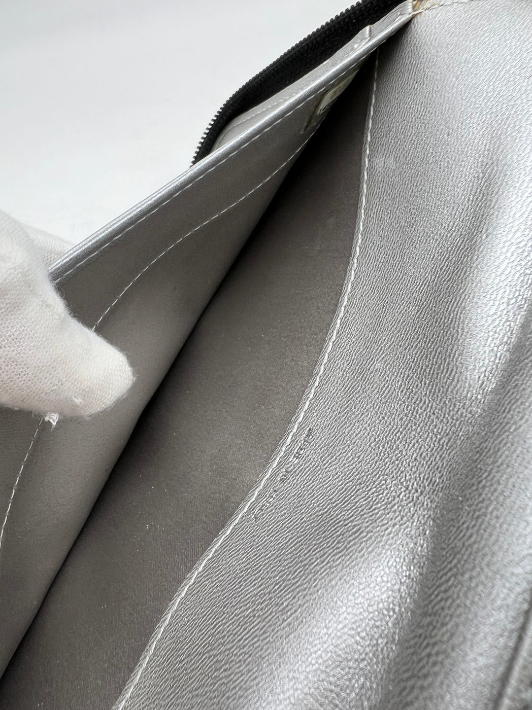 CHANEL LAMBSKIN CAMELLIA EMBOSSED ZIP AROUND ORGANISER WALLET