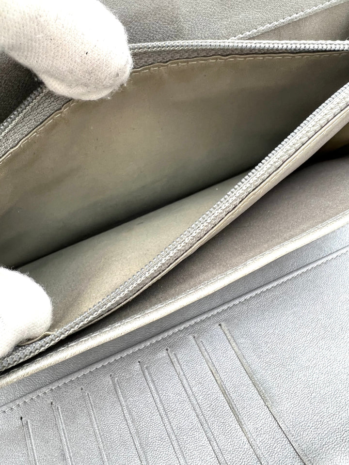 CHANEL LAMBSKIN CAMELLIA EMBOSSED ZIP AROUND ORGANISER WALLET