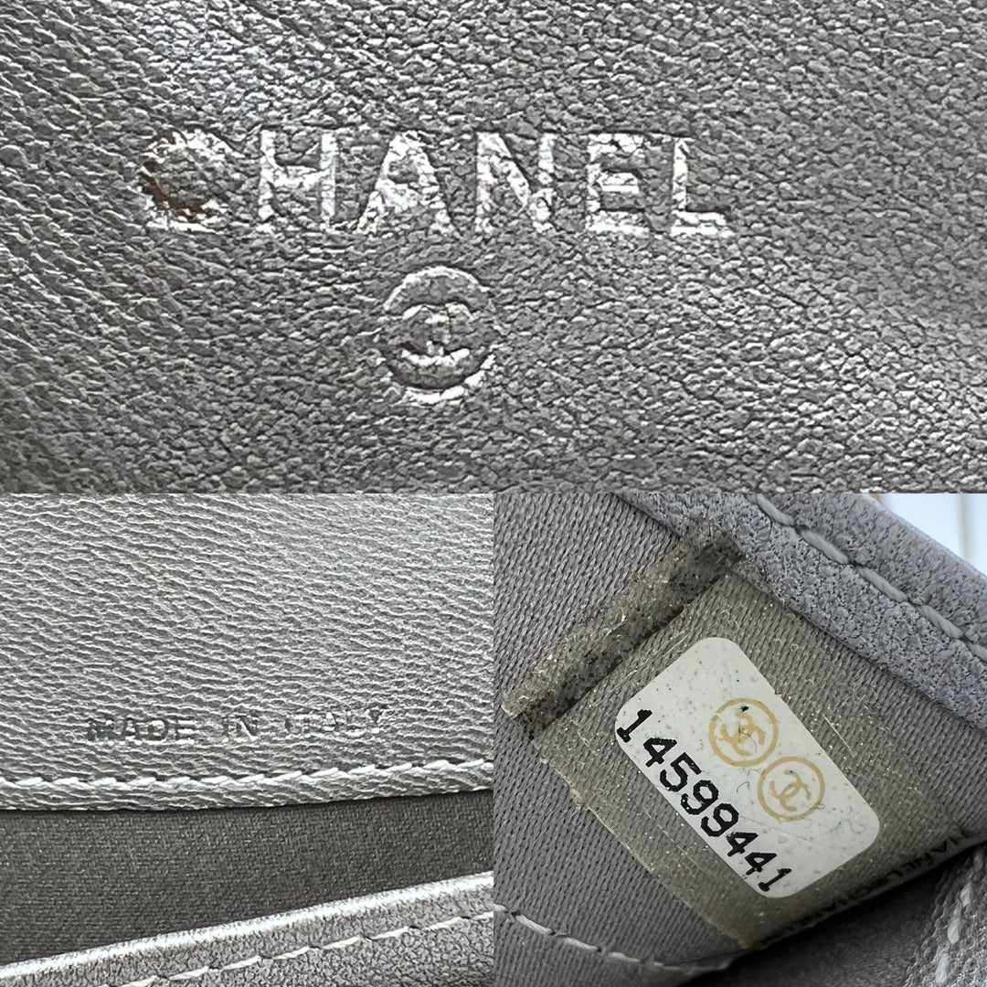 CHANEL LAMBSKIN CAMELLIA EMBOSSED ZIP AROUND ORGANISER WALLET
