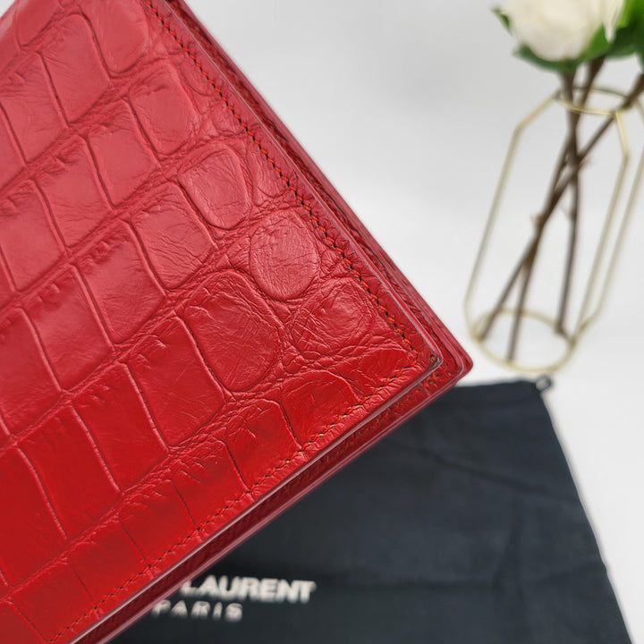 YVES SAINT LAURENT EMBOSSED CROC LEATHERCLUTCH