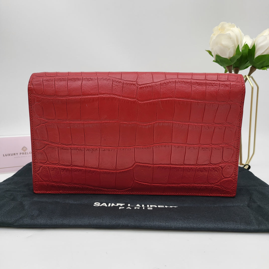 YVES SAINT LAURENT EMBOSSED CROC LEATHERCLUTCH