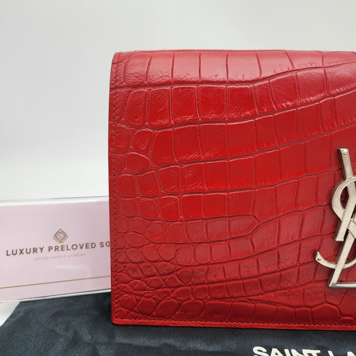 YVES SAINT LAURENT EMBOSSED CROC LEATHERCLUTCH