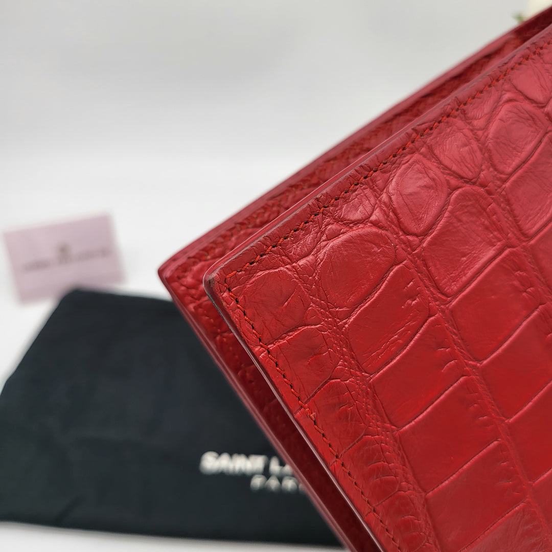 YVES SAINT LAURENT EMBOSSED CROC LEATHERCLUTCH